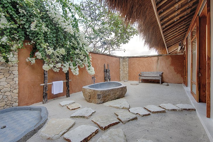 Outdoor bathroom with open air bathtub and shower