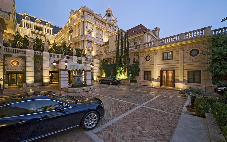 Hotel Metropole parking with luxury cars