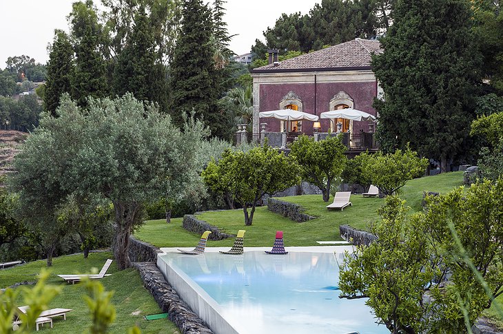 Monaci delle Terre Nere building and swimming pool