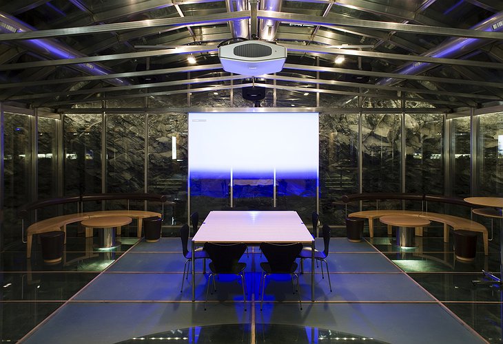 Cavern – a glass and steel structure deep into the rock, for meetings, dinners, movie nights