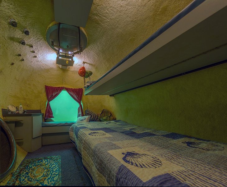 Jules' Undersea Lodge Bedroom With A Round Window