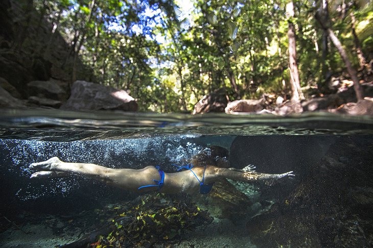 Bikini girl swimming under water