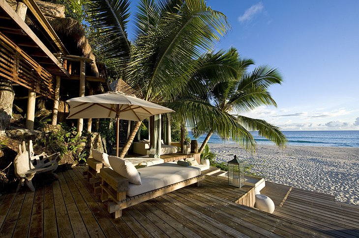 Sunbathing on the terrace of North Island hotel in Seychelles