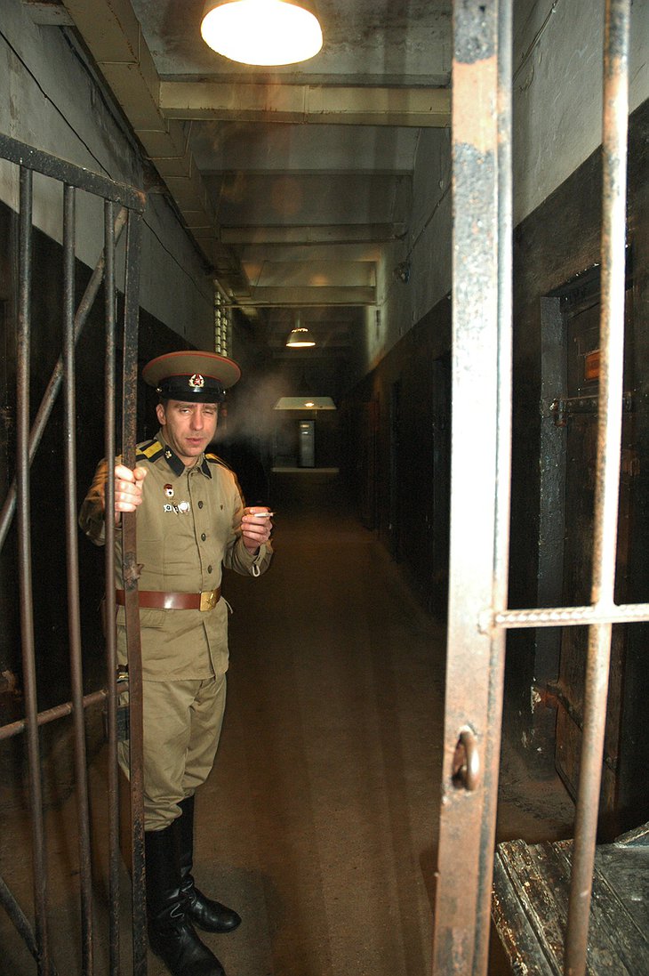 Prison guard welcomes you to the jail cells
