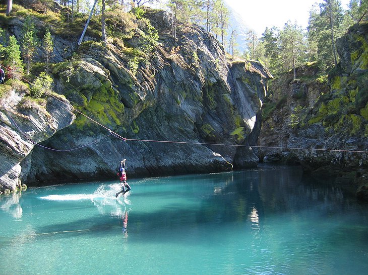 Zip-lining above the crystal clear water of the lake