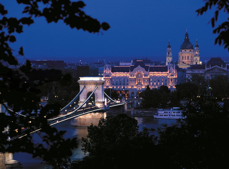 Budapest at night with the Chain Bridge lit up and the Four Seasons Hotel Gresham Palace in the background