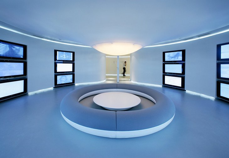 Futuristic waiting room with plasma TVs at Hotel Silken Puerta América Madrid hotel