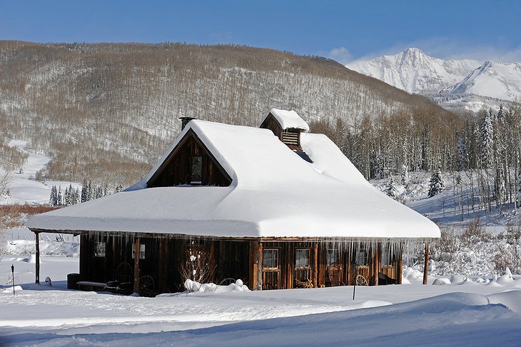 Dunton Hot Springs wooden house under the snow