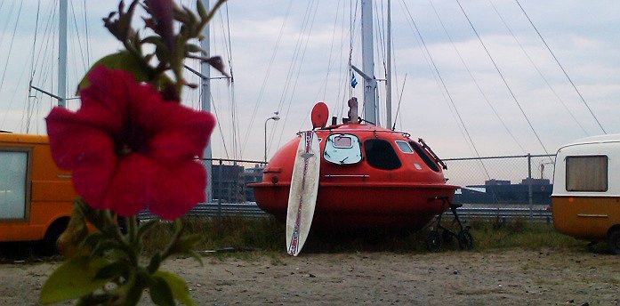 Capsule Hotel - Orange UFO-Like Floating Capsule