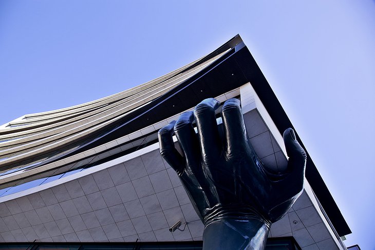 EVOLUTION Lisboa Hotel Quirky Facade With Giant Hand Holding The Structure
