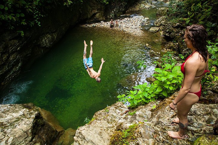 Backflip from the rocks to the jungle lake