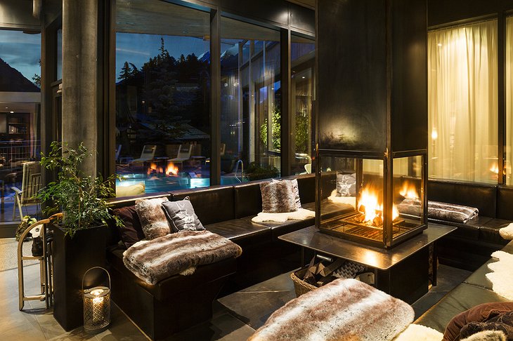 Hotel Matterhorn Focus lounge at night with fireplace