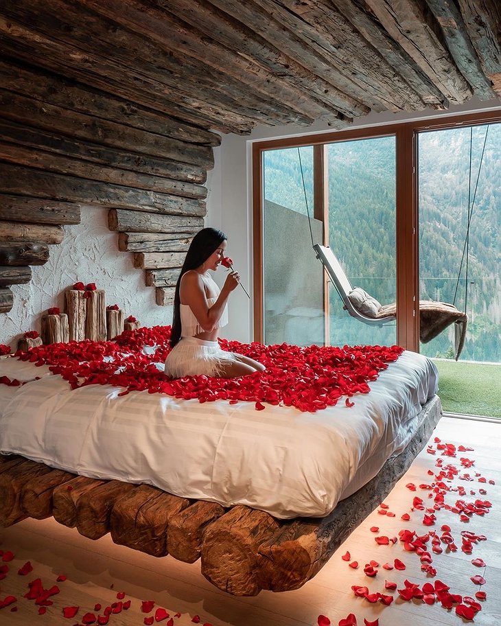 Chalet Al Foss Alp Resort Unique Room With A Swing Bed And Rose Petals