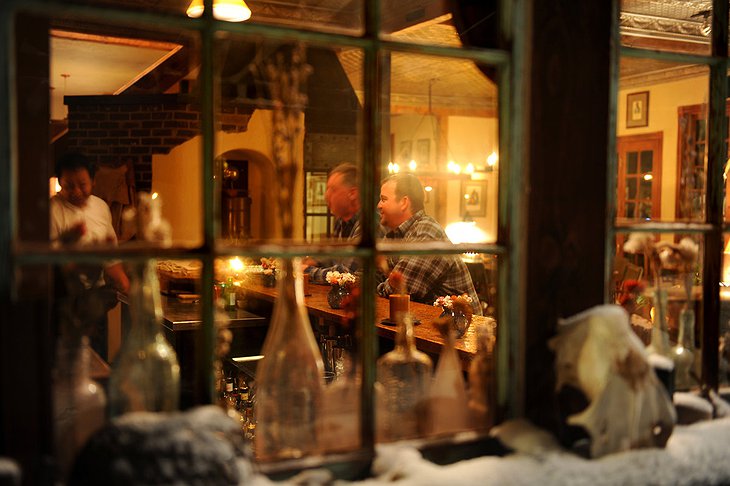 Wood cabin interior through the window