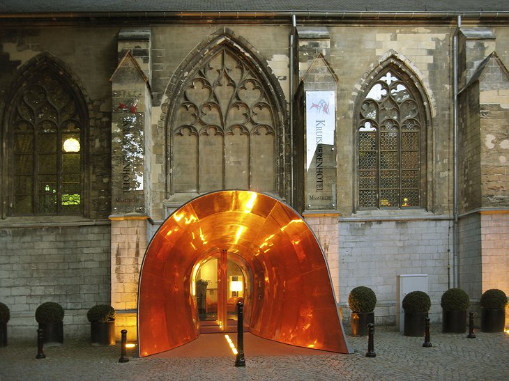 Kruisherenhotel gothic church entrance in a golden tunnel