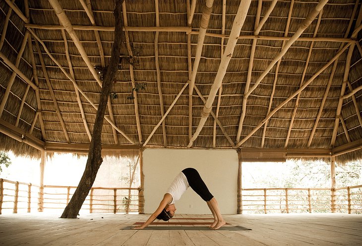 Young girl doing yoga at an open studio