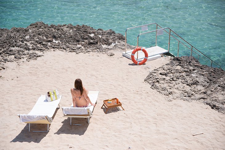 Sunbathing girl at the private beach