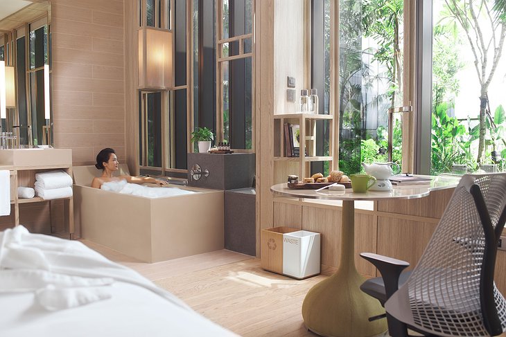 Parkroyal on Pickering bathtub inside the room with an asian girl sitting inside it
