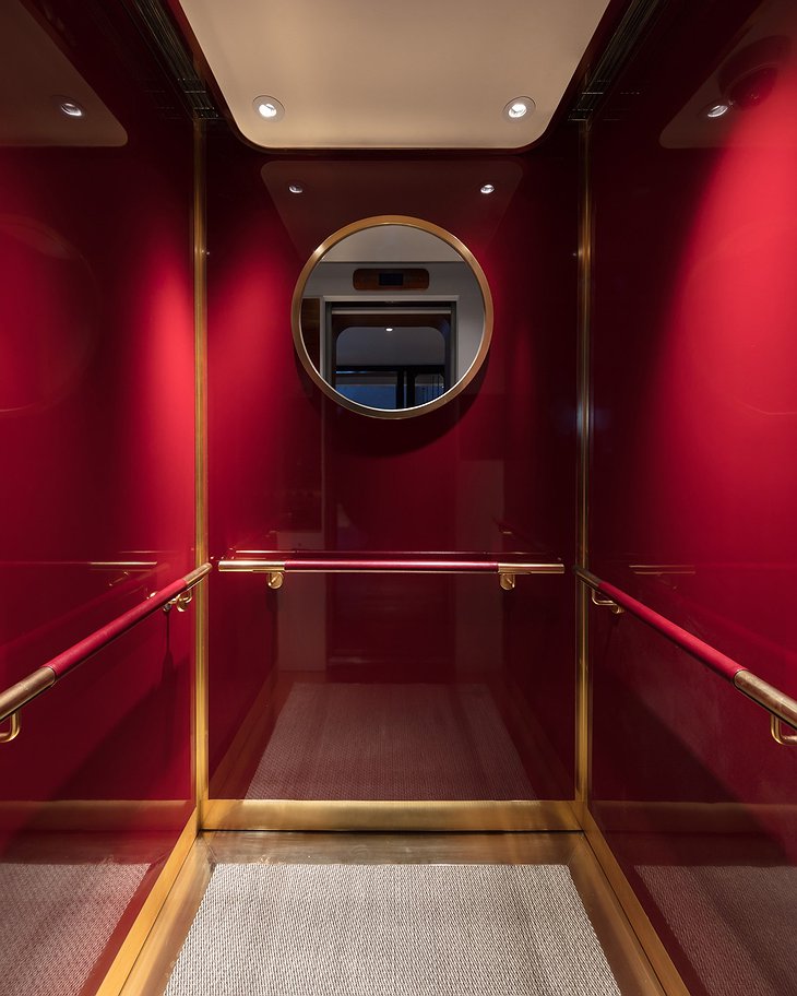 Gleaming red lacquer color of The Fleming elevators