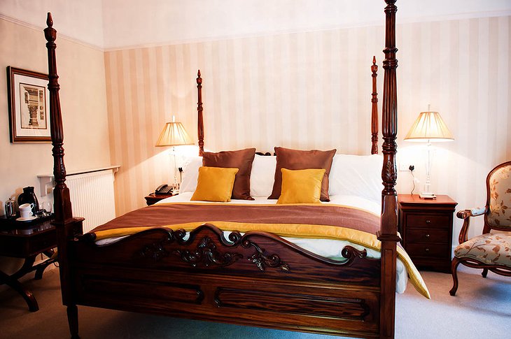 Chateau Rhianfa room with antique bed