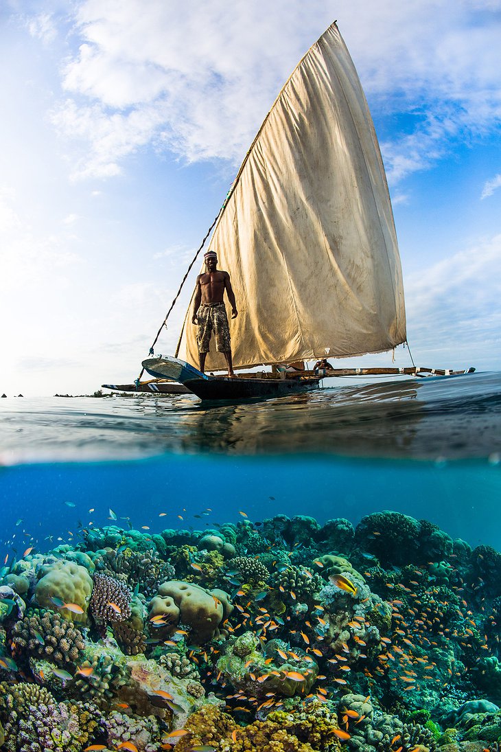 Ngalawa boat and coral reef