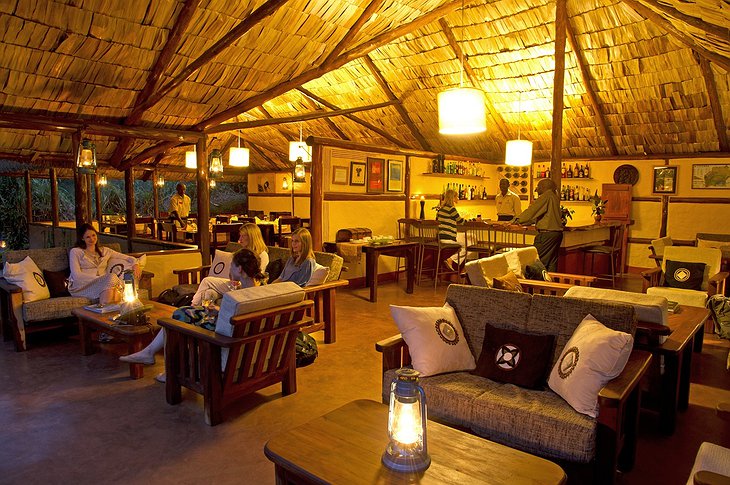 Sanctuary Gorilla Forest Camp lounge and bar in the evening