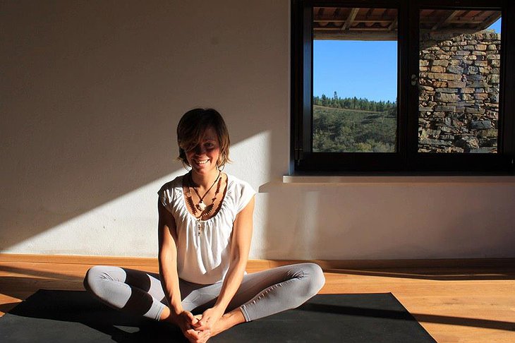 Blond girl doing yoga at Nespereira Estate