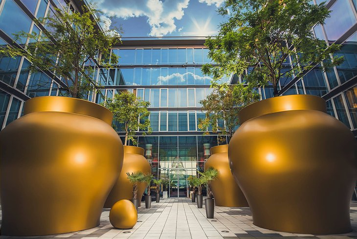 Kameha Grand Bonn entrance with large golden bowls for trees